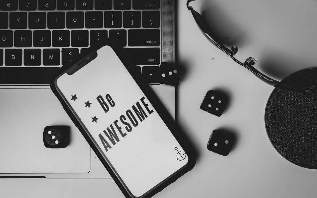 An iPhone with "Be Awesome" as wallpaper